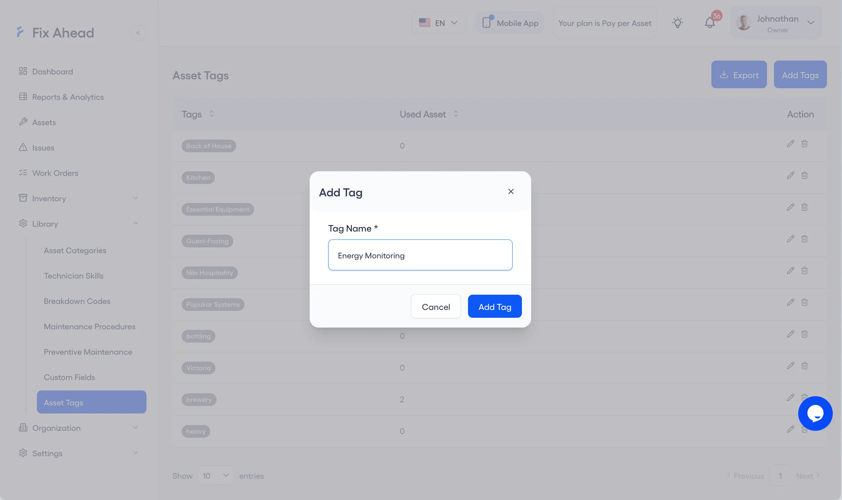 The Add Tag modal over the Asset Tags list: one field, Tag Name, holds Energy Monitoring, with Cancel and Add Tag beneath it.