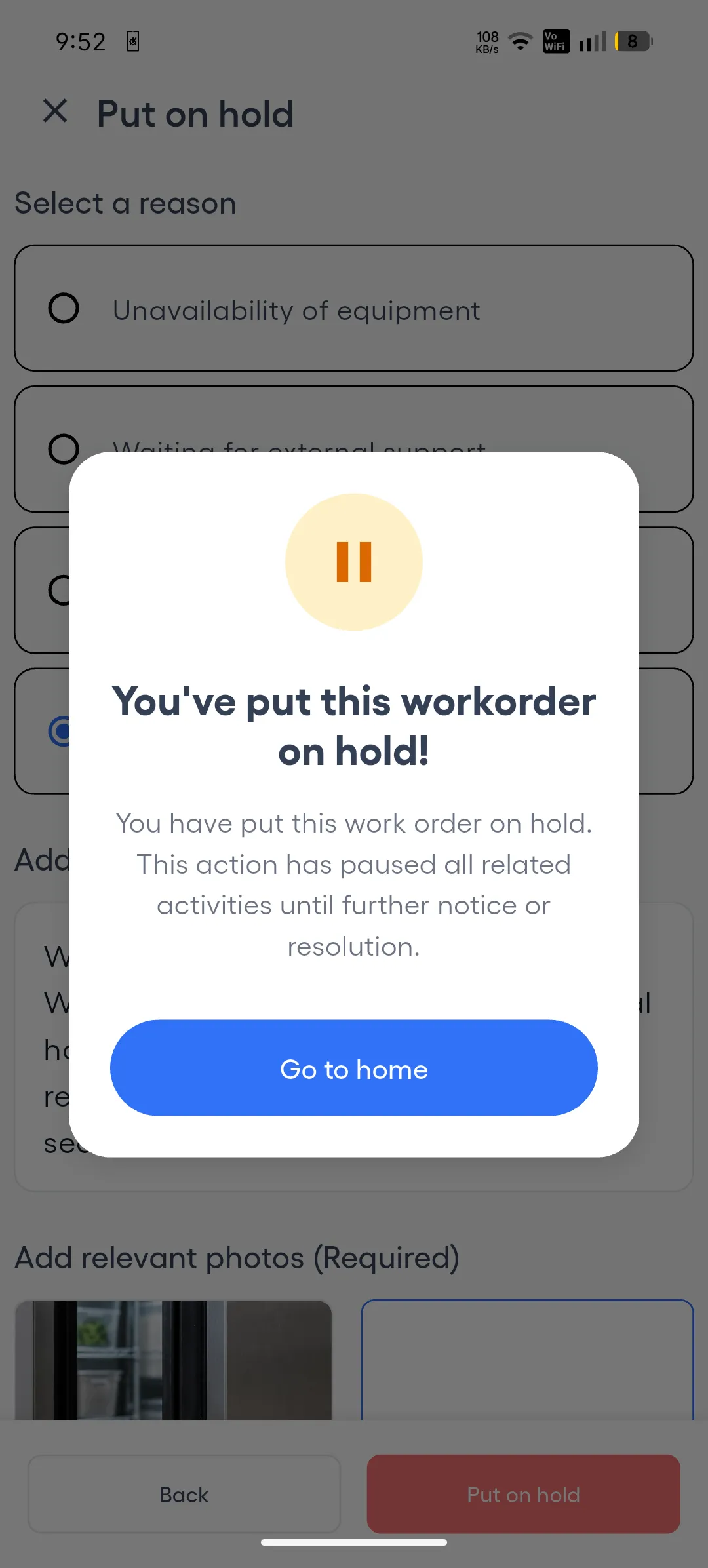 The Put on hold screen on a phone with a message over it: “You’ve put this workorder on hold!”, a pause icon, and a Go to home button.